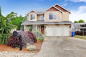 House exterior with beautiful curb appeal, garage and driveway v