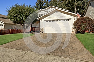 House exterior. Close up of garage door with driveway