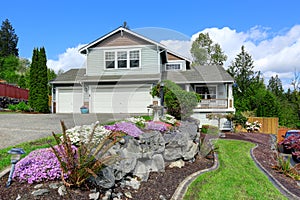 House exterior with curb appeal. View of porch and garage