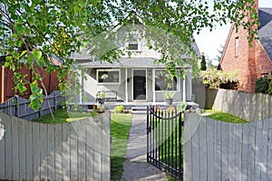 House exterior. Entrance porch and front yard view