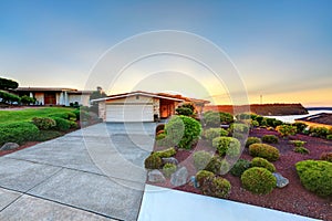 House exterior. Garage with concrete driveway