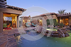 House Exterior with swimming pool and hot tub photo