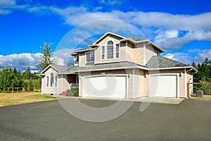 House exterior with two car garage and driveway