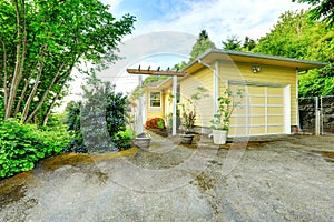 House exterior. View of garage and driveway