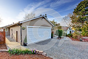 House exterior. View of garage and driveway