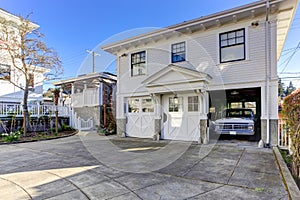 House exterior. View of garage and driveway