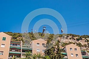 House facade and cliff structure with cable car going up to The Rock, Gibraltar