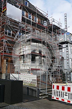 House facade with scaffolding, renovation and reconstruction of an old villa in Hamburg, Germany