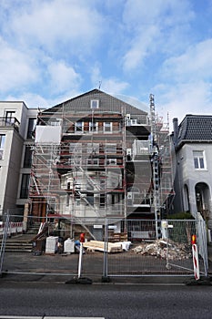 House facade with scaffolding, renovation and reconstruction of an old villa in Hamburg, Germany