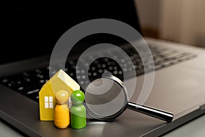 House, family and magnifying glass on laptop keyboard.