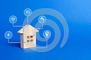 House figurine and public utilities symbols icons. Choosing a house to buy, assessing the cost and condition of the building photo