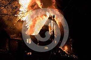 House fire with intense flame, fully engulfed house fire photo