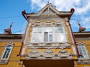 House with firebirds, Tomsk. Russian style in architecture. Wooden house, Tomsk, Russia. Beautiful carved elements