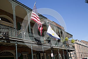 House with flags in French Quarter New Orleans