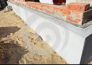 House foundation wall insulation, plastering, damp proofing, waterproofing