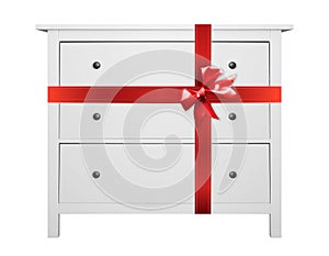 House furniture - Modern white commode gift tied red bow. Isolated