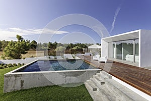 House with garden swimming pool and wooden deck