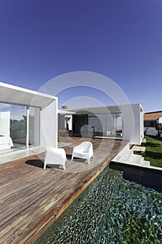 House with garden swimming pool and wooden deck