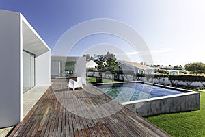 House with garden swimming pool and wooden deck