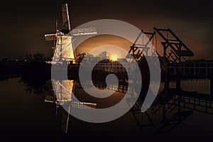 House and the Giant Dutchman at night