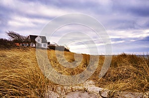 House in the grass on the dunes at the Baltic Sea. Ahrenshoop