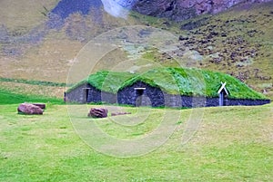 House with grass roof in heimaey, iceland. Green and eco house architecture. Ecology and environment concept. Eco