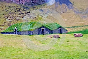 House with grass roof in heimaey, iceland. Green and eco house architecture. Ecology and environment concept. Eco