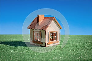 House on green grass, model