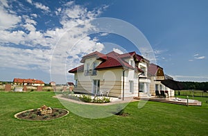 House in green lawn