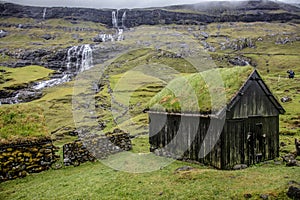 House with green roof in saksun