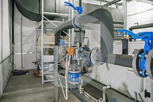 House heating system with many pipes, metal tubes and automated control equipment