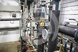 House heating system with many steel pipes, manometers and metal tubes