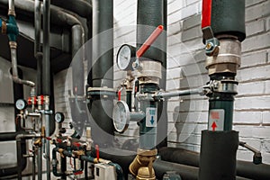 House heating system with many steel pipes, manometers and metal tubes