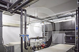 House heating system with many steel and plastic pipes, manometers and metal tubes and automated control equipment