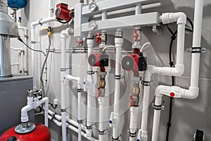 House heating system with modern plastic pipes, manometers and tubes close up in boiler room