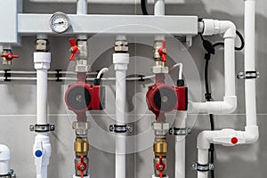 House heating system with modern plastic pipes, manometers and tubes close up in boiler room