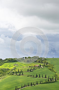 House on a hill with a winding road