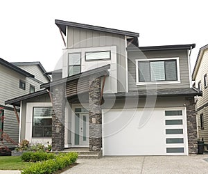 House Home Gray White Exterior Elevation Roof Peak Details photo