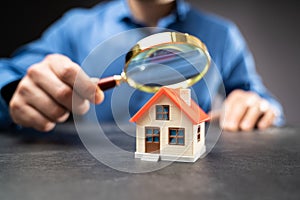 House Or Home Inspection Using Magnifying Glass. Tax