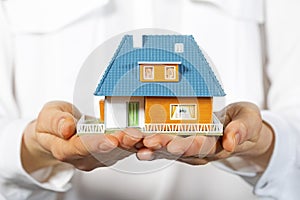 House in human hands, concept of new real estate