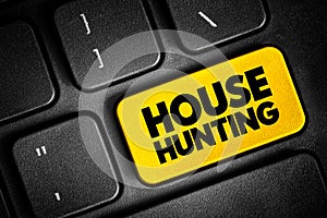 House Hunting - seek a house to buy or rent and live in, text concept button on keyboard