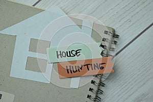 House Hunting write on sticky notes isolated on office desk