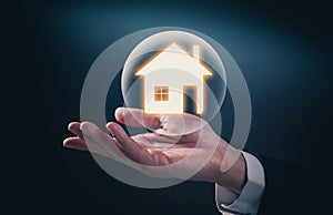 House icon on the hand, mortgage loan home and insurance concept