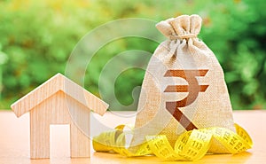 House and indian rupee money bag. Building maintenance. Mortgage loan calculation. Estate appraisal. Budgeting. Rental income.