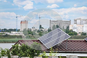 House with solar panels on roof. Alternative energy source