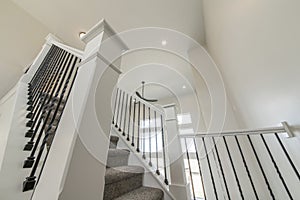 House interior with a view of a staircase and window