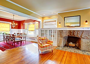 House interior.Yellow living room and contrast red dining area