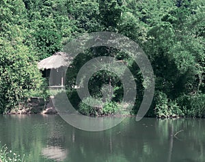 A house in the jungles of Vietnam. Toning.