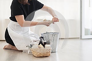 House keeping concept. Woman wiping floor. Woman doing chores at home.