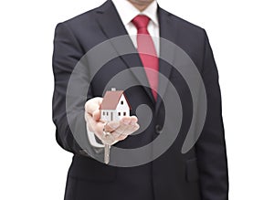 House key in businessman hand